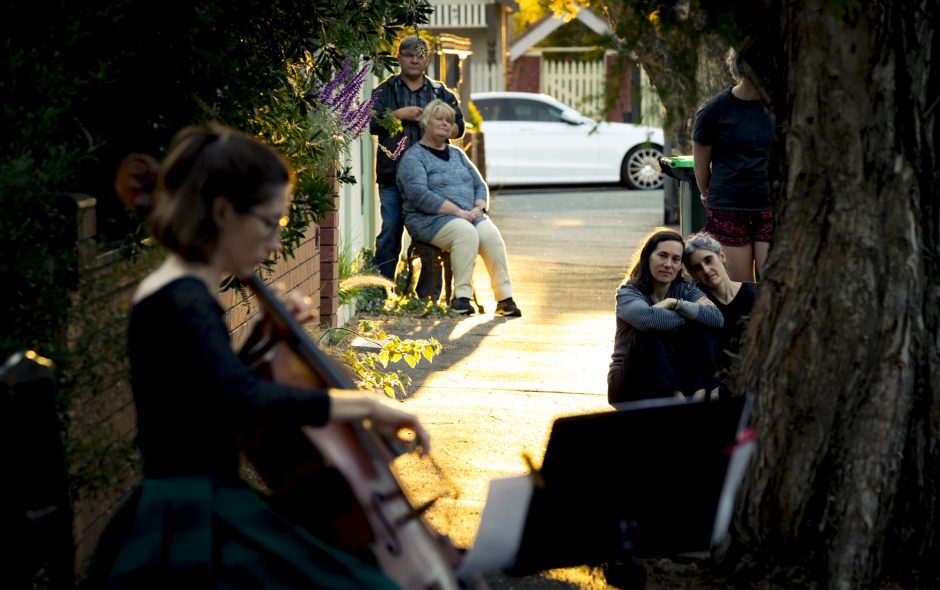 31/03/20 Josephine Vains, has been playing mini social distancing "concerts" for her street in Brunswick. Neighbours come out of their houses and stand the required distances away to enjoy the music and the community spirit. Photograph by Chris Hopkins