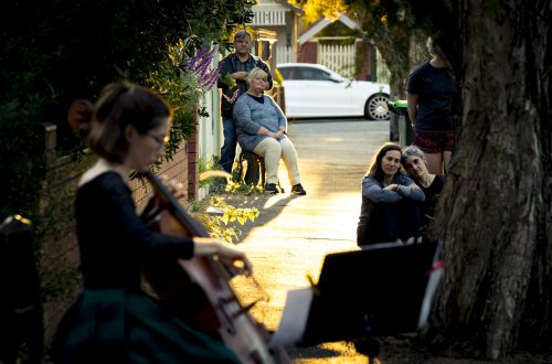 31/03/20 Josephine Vains, has been playing mini social distancing "concerts" for her street in Brunswick. Neighbours come out of their houses and stand the required distances away to enjoy the music and the community spirit. Photograph by Chris Hopkins